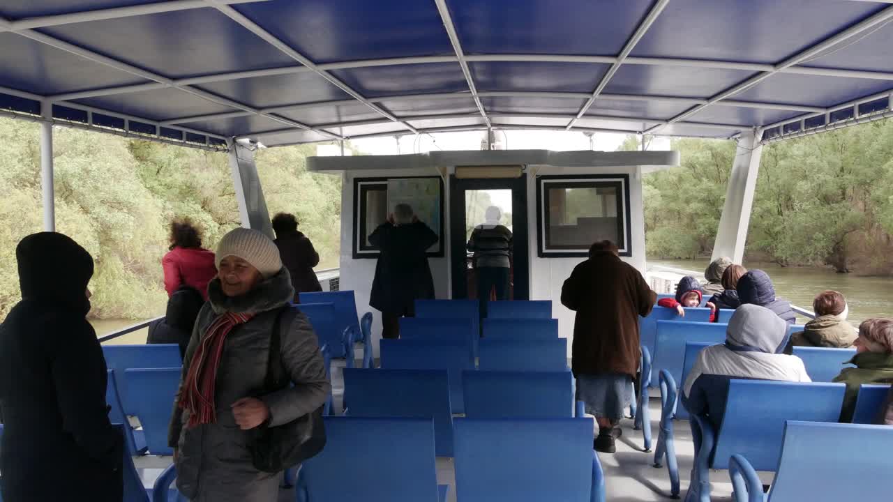 Delta of the Danube River. Romania. April 20, 2019. Tourists on the deck of a cruise ship.