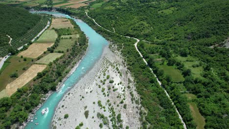 vjosa wild emerald river valley serpentines through spring fields and colorful rolling hills albania