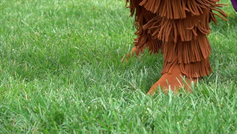 native american feet dance in time with the pow wow drum.