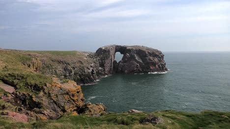 long shot of bullers cliffs looking to dunbuy arch