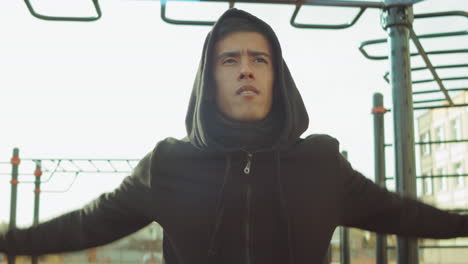 man warming up before training on workout playground