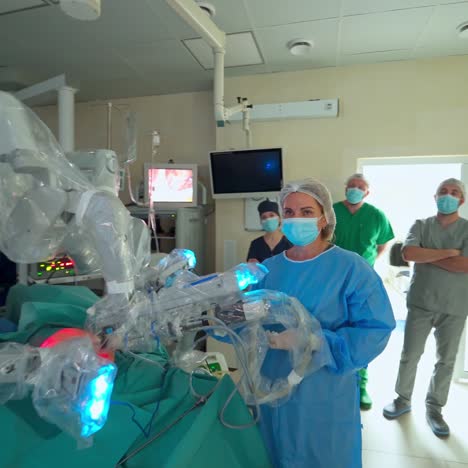 robot performs surgery in hospital. surgeons team performing operation in surgery room