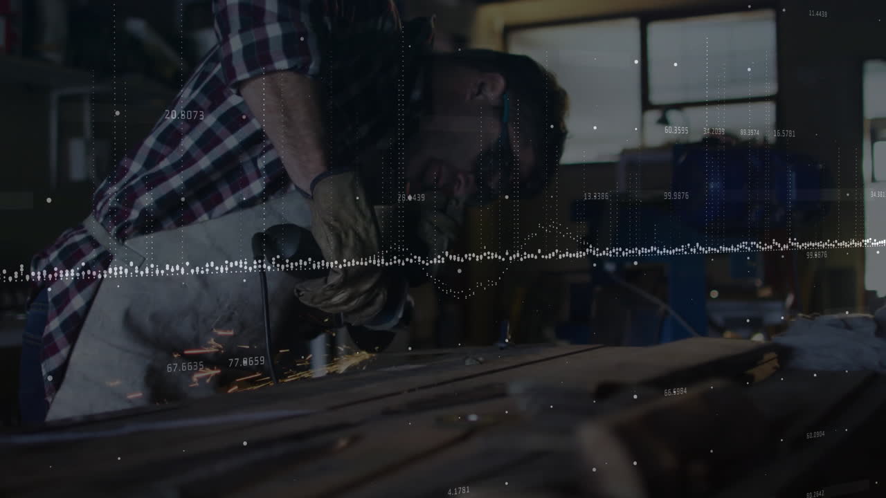 Male craftsman using grinder in industrial workshop, displaying data points and dotted graph lines