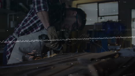 male craftsman using grinder in industrial workshop, displaying data points and dotted graph lines