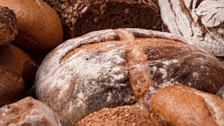 Freshly baked natural bread is on the kitchen table.
