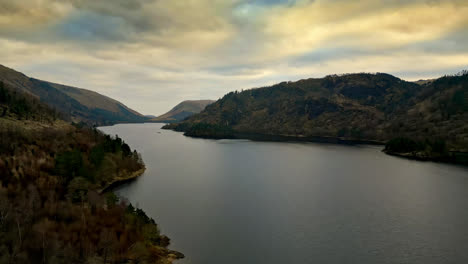 Experience-the-mysterious-and-dramatic-beauty-of-the-Cumbrian-landscape-through-captivating-drone-footage,-revealing-Thirlmere-Lake-embraced-by-majestic-mountains