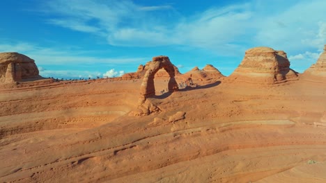 several tourist excursion over red rock wonderland at arches national park, utah, united states