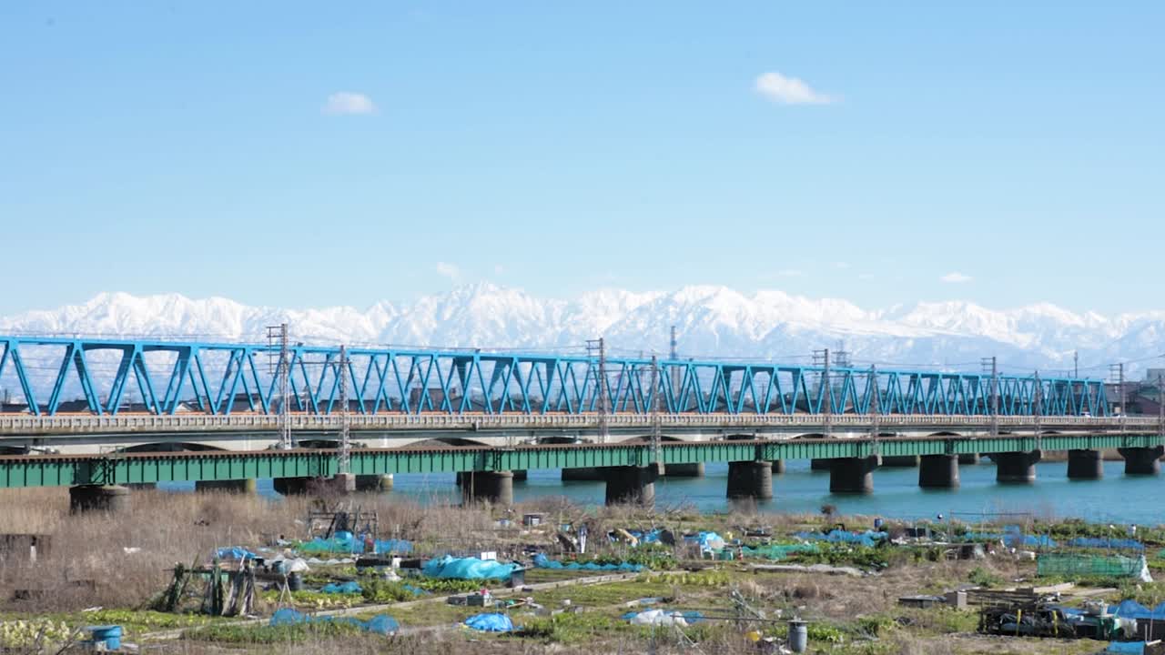 Tateyama White Top Mountain With Shinminato Bridge In Spring. Toyama Japan