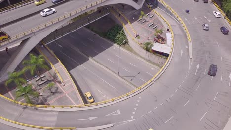 Tilting-aerial-slow-shot-of-glorieta-Aguacatala-and-Envigado-in-Medellin