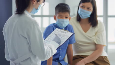 female pediatrician giving consultation during pandemic
