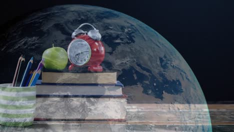 animación de una pila de libros con manzana y despertador vintage en todo el mundo