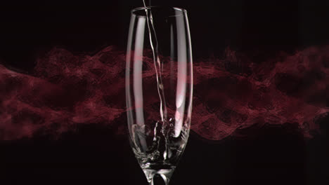 Animation-of-shapes-over-glass-of-champagne