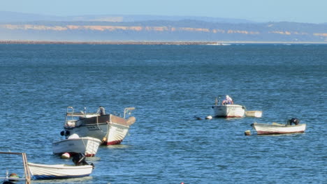 Small-artisanal-fishing-boats,-parked-at-the-fishing-pier