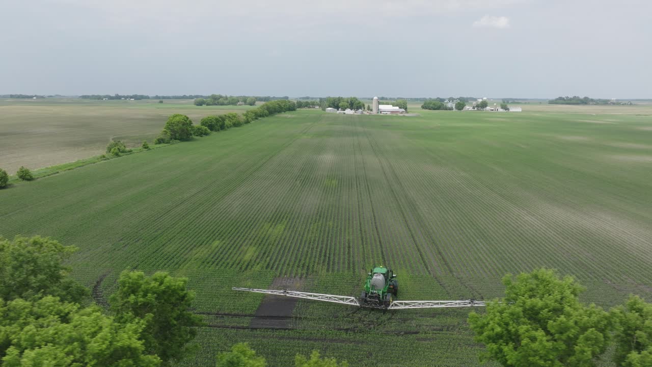 Aerial View Of Farmer On Sprayer Machine Working In The Farm