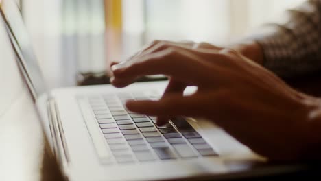 Person typing on a laptop