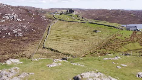 Drone-shot-of-the-'Dun-Carloway-Broch'-on-the-west-coast-of-the-Isle-of-Lewis,-part-of-the-Outer-Hebrides-of-Scotland