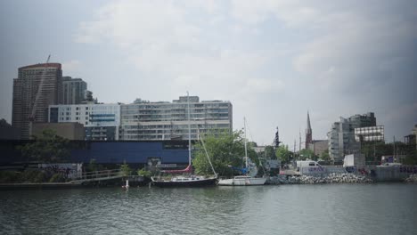 Serene-sailboats-rest-on-gentle-waves-at-the-dock,-bobbing-gracefully