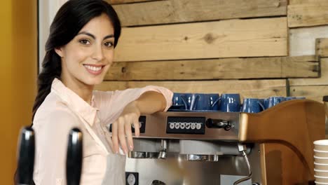 Waitress-cleaning-coffee-machine-in-cafe-4k