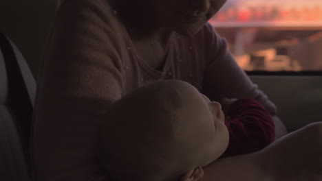 mother with baby on car journey