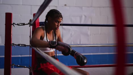 mixed race woman in boxing gym