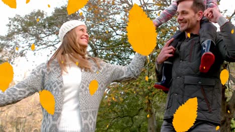 animation of autumn leaves falling over happy caucasian family in park