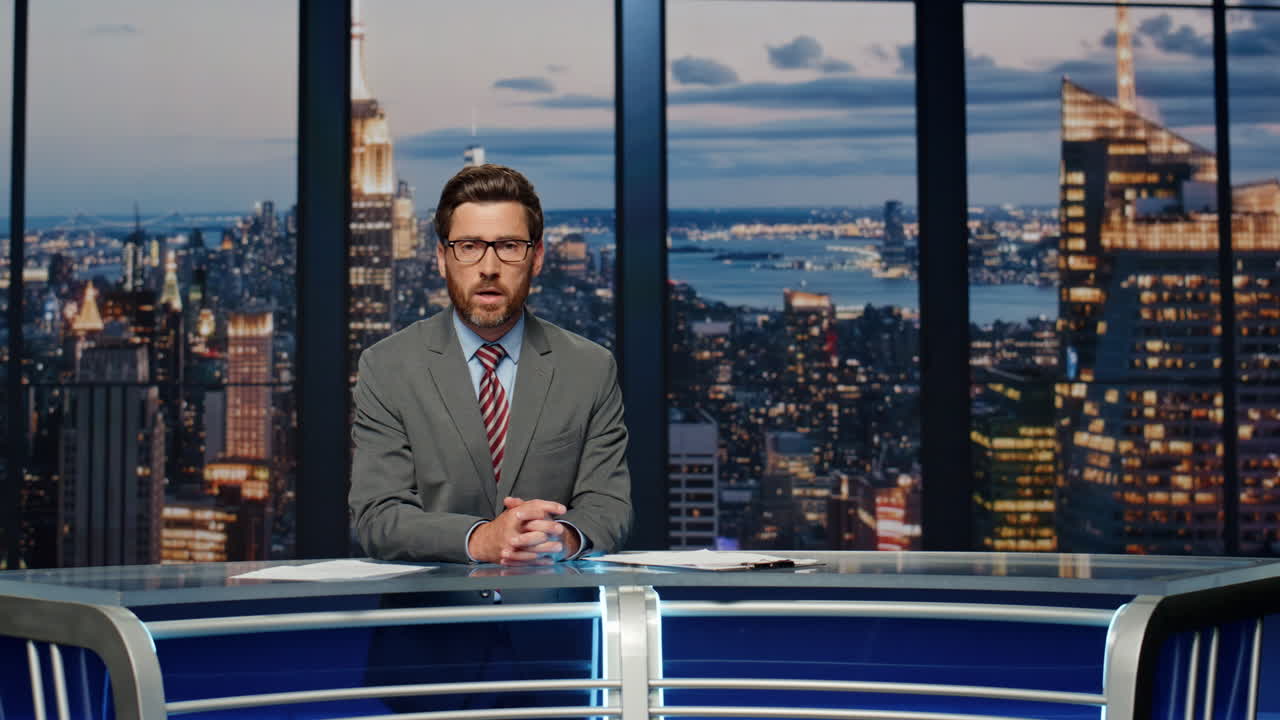 Serious anchor reporting events at newsroom. Presenter speaking at news desk