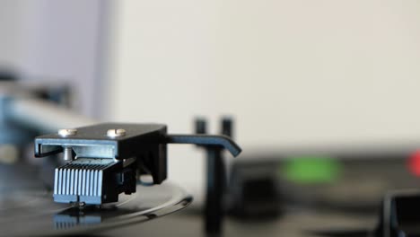 turning on the vinyl record player