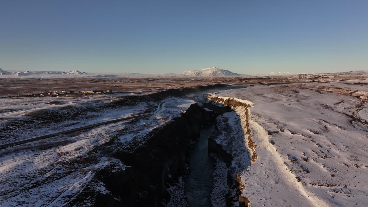 Stunning aerial view of Gullfoss Canyon and Hvítá River in Iceland, snow-covered cliffs, dramatic landscapes and winter beauty.