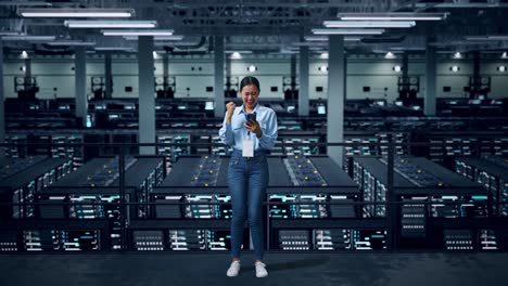 woman celebrating success in a data center