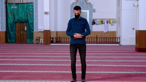 Young-Man-With-Mask-Worships-In-Mosque