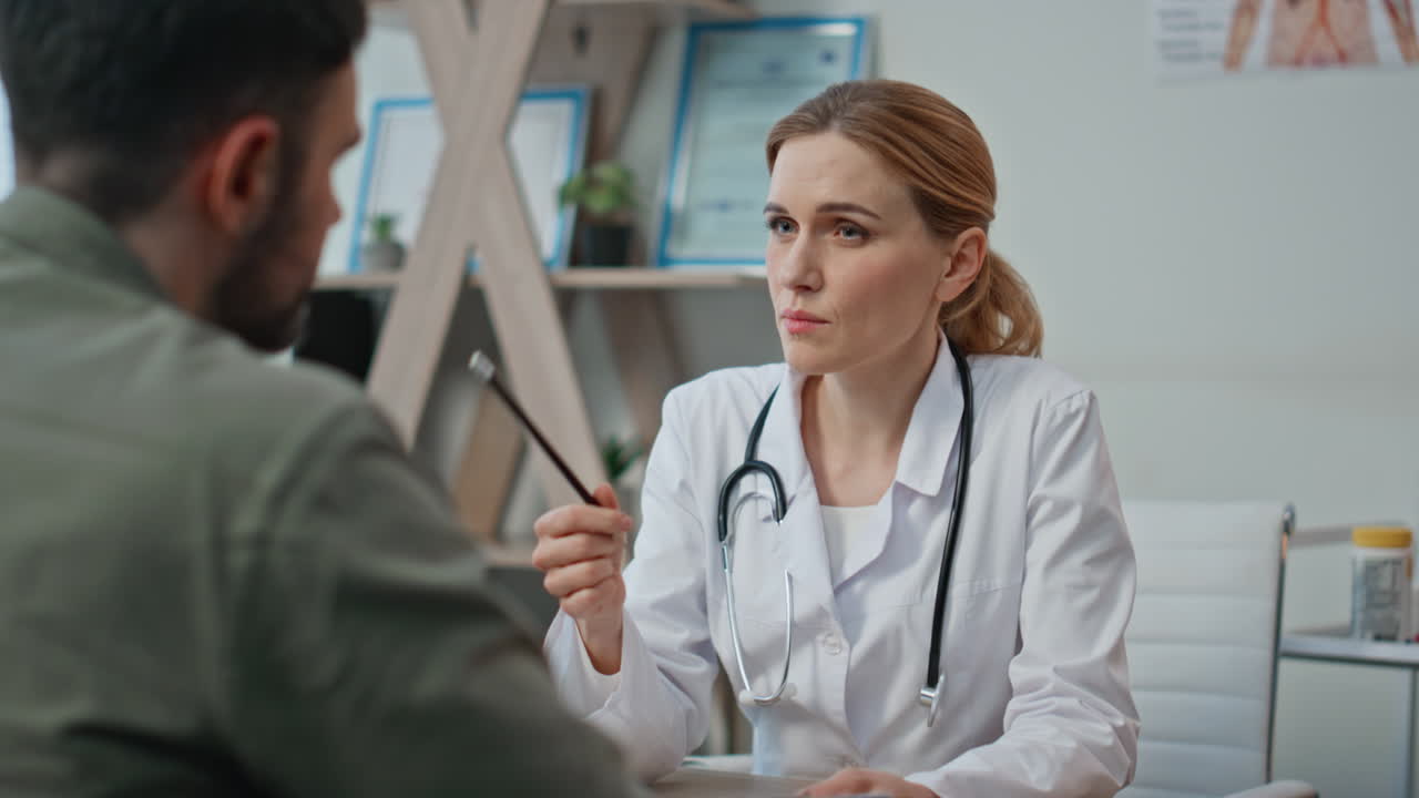 Woman practitioner explaining diagnosis during insurance appointment closeup