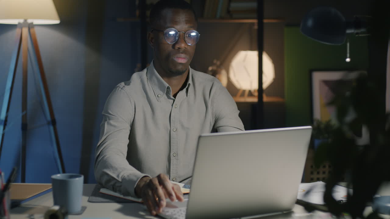 Man Working Late Night on Laptop