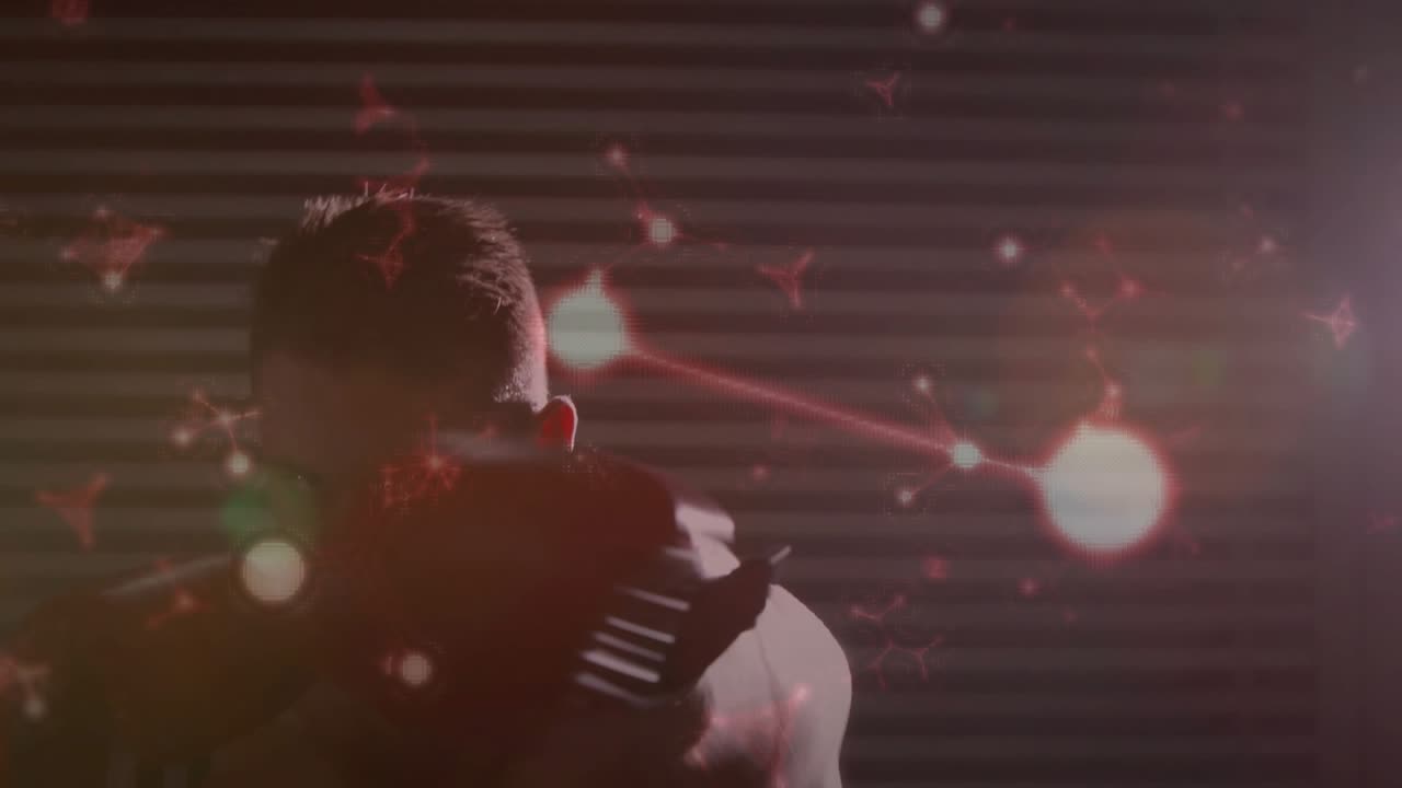 Male boxer tightening guard and starting training jabs in shutter gym, red particles occluding face