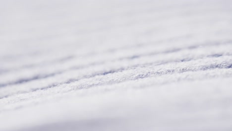 Micro-video-of-close-up-of-white-wooly-fabric-with-copy-space