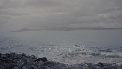 Open-sea-with-island-view-across-the-distance-on-a-sunny-day