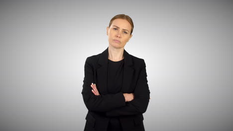 A-Serious-Angry-Business-Woman-Folding-Arms-With-White-Studio-Background