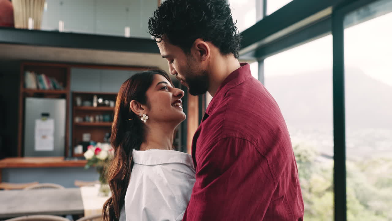 Happy Young Couple Dancing and Embracing in Modern Home
