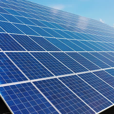 close-up of solar panel collecting sunlight. ecology innovation of clean sun energy. blue solar device on the ground.