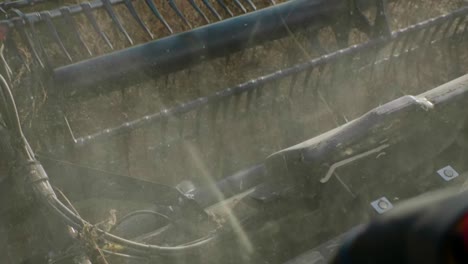 combine harvester harvesting organic soybeans on sunny day slow motion