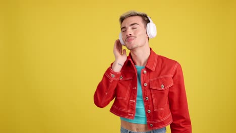 man with headphones dancing to music