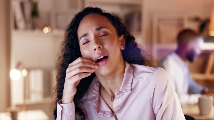 Tired, bored and a woman yawning at work during