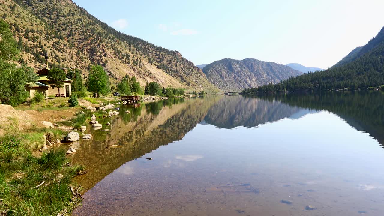 Static footage of Georgetown Lake in Georgetown Colorado. Scenic shot with clear water and mountains in the background.