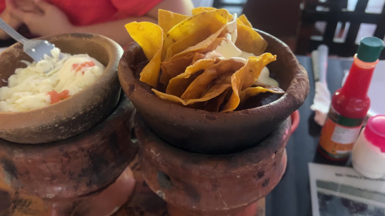 Honduras traditional anafre hondureño served in clay pots with tortillas and fresh sides, authentic local dining experience and Central American cuisine.