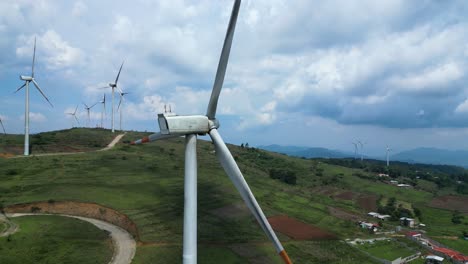 wind turbines operating near rural community, climate solutions, clean energy production