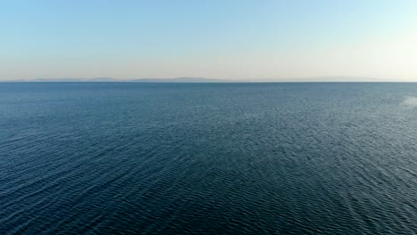 aerial forward flight over marmara sea through the horizon, balikesir, turkey