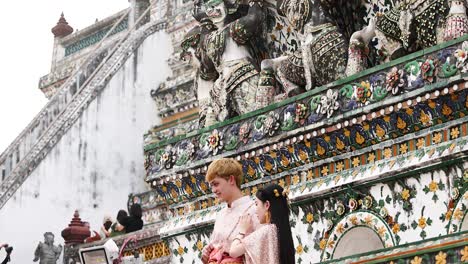 wat arun, bangkok, thailand: temple exterior and tourists