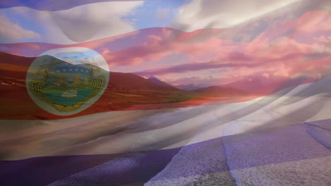 digital composition of waving costa rica flag against aerial view of the beach