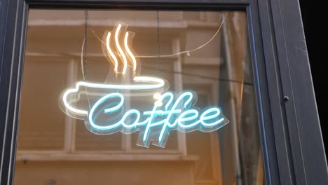 neon coffee sign on a shop window