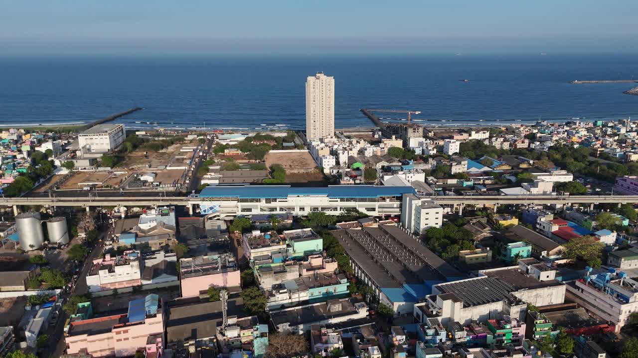 Drone shot capturing dense urban landscape of North Chennai in evening light