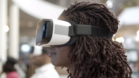 closeup shot of woman wearing virtual reality glasses